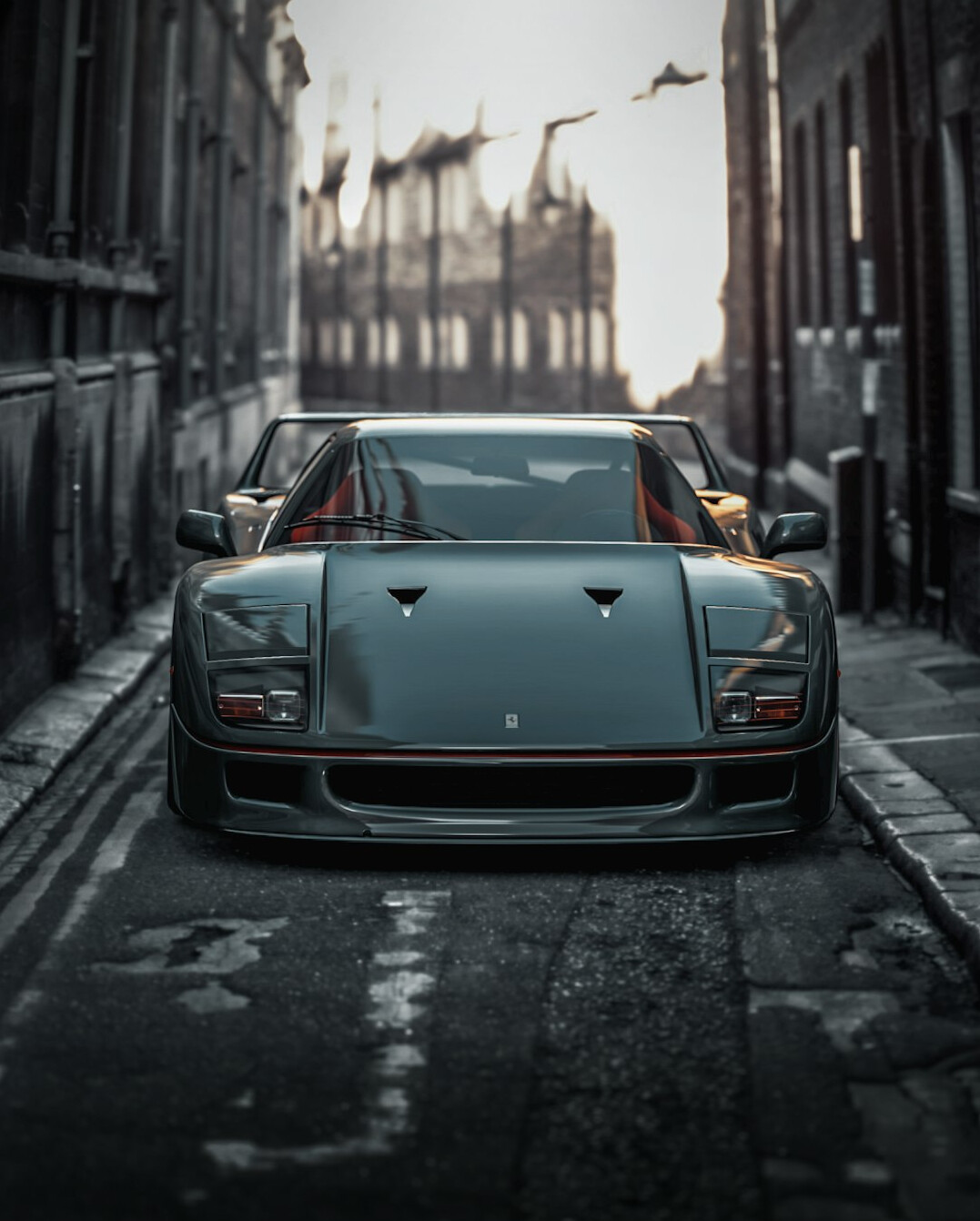 Vintage Ferrari sports car parked on a Montevideo street at dusk