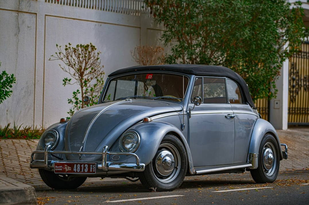 Fully restored vintage convertible car with glossy paint finish
