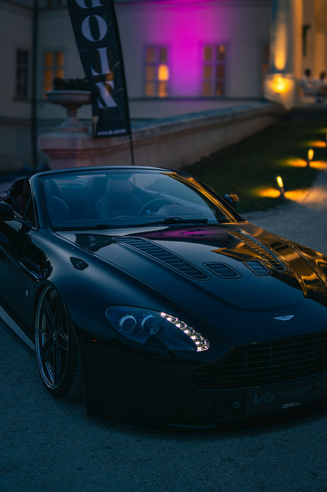 Modern hypercar displayed at an evening showcase event